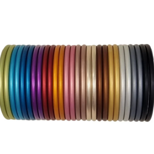 Rainbow stack of aluminium sling rings for babywearing